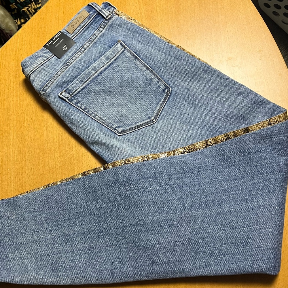 NWT jeans with faux leather snakeskin detail